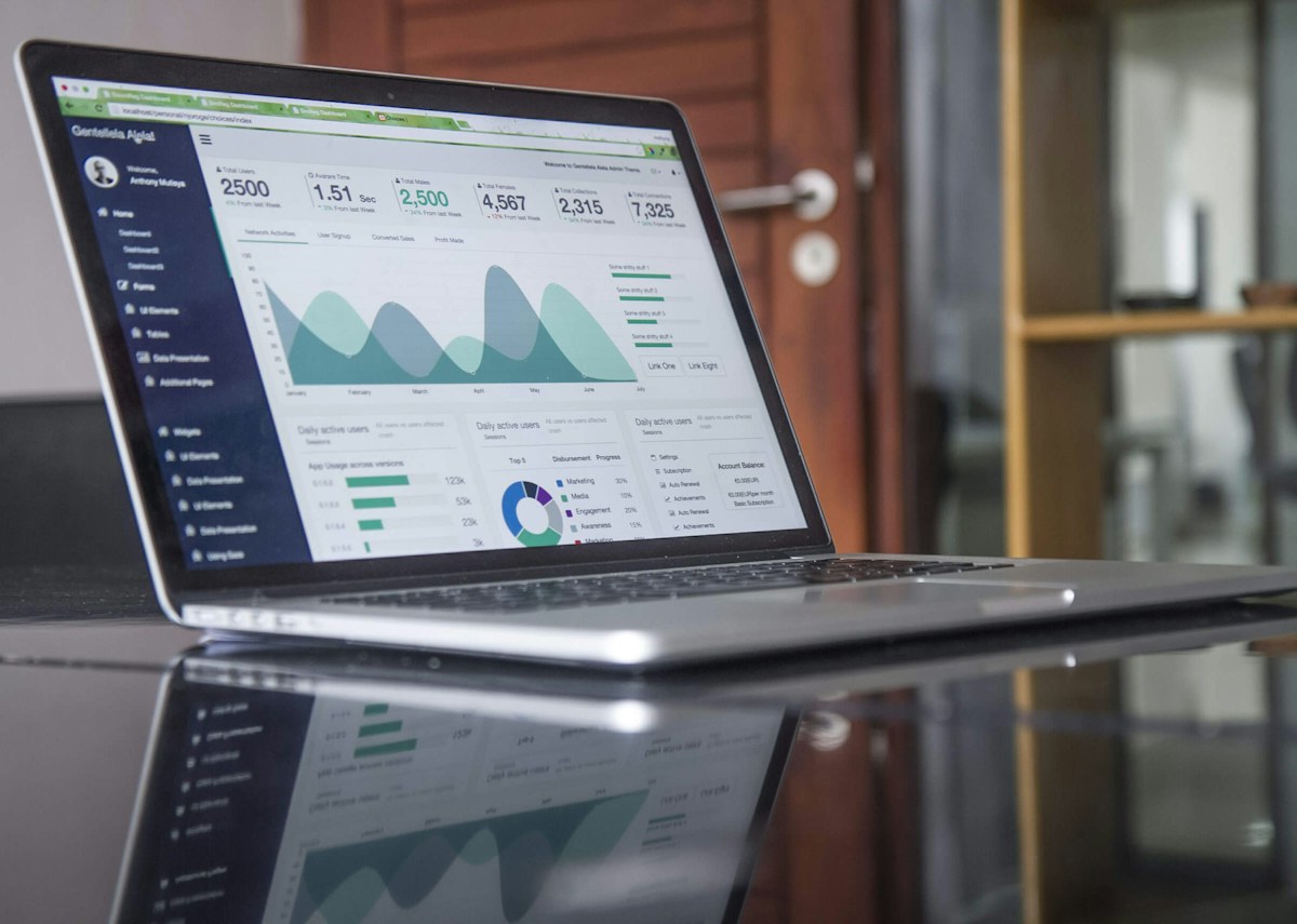 A website and its analytics displayed on a laptop